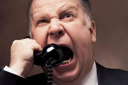 Man yelling into telephone