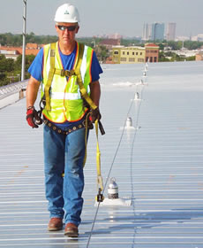 Worker Walking Rooftop with Safety Harness